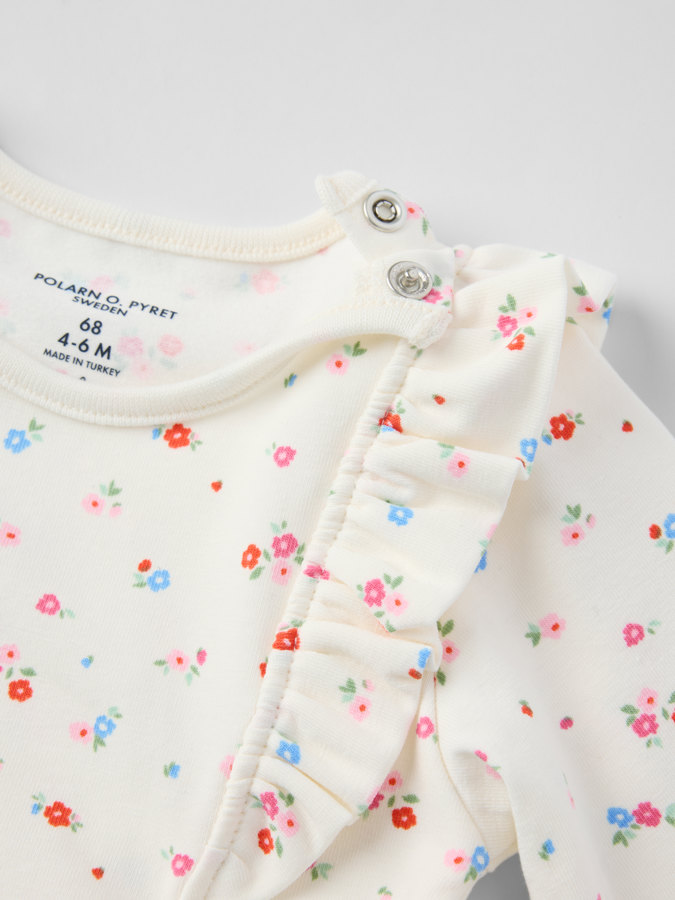 Långärmad body blommig Långärmad body blommig